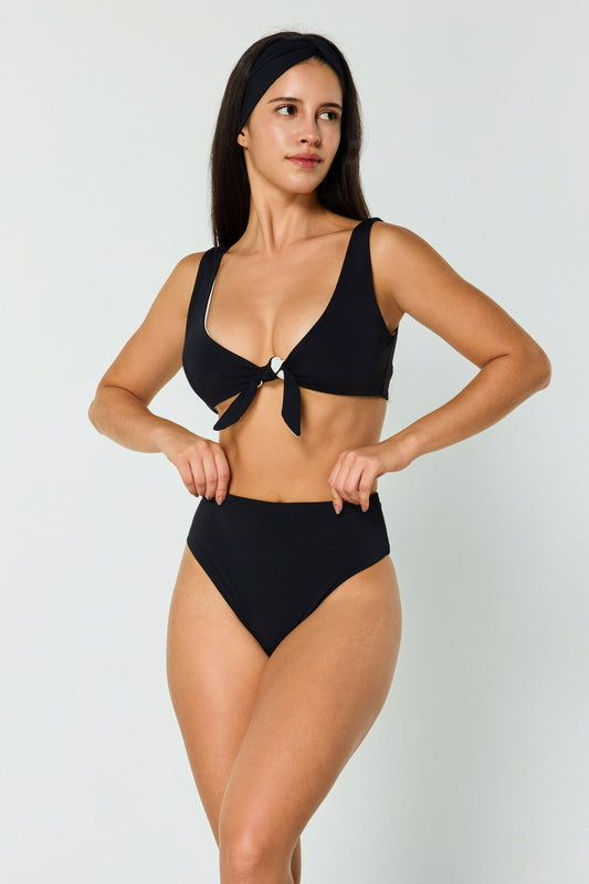 black reversible bikini on model angled front pose
